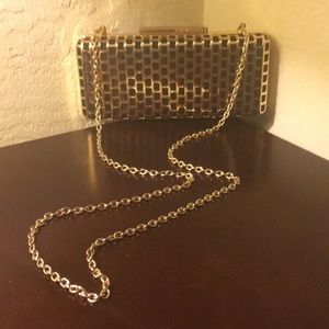 BCBGMAXAZRIA BLACK AMD GOLD CLUTCH. Like new.